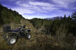 Quadbike parked on mountain ridge