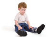 Young Upset Boy Sitting Down