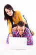 Teen girl and boy with white laptop computer Teen girl and boy with white laptop computer