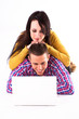 Teen girl and boy with white laptop computer Teen girl and boy with white laptop computer