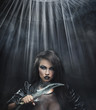 Attractive brunette beauty with knife