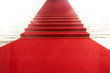 Staircase with red carpet, illuminated by light Staircase with red carpet, illuminated by light