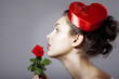 Glamorous girl in an elegant hat in the form of heart