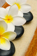 frangipani flowers and massage stones