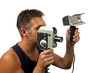Man with old fashion film camera over white background