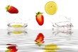 Fruits splashing into water