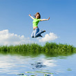 Foto: pretty young woman is jumping pretty young woman is jumping