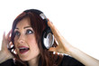 Photo: Woman with headphones isolated high key portrait Woman with headphones isolated high key portrait