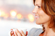 Pretty young lady enjoying a cup of coffee at home