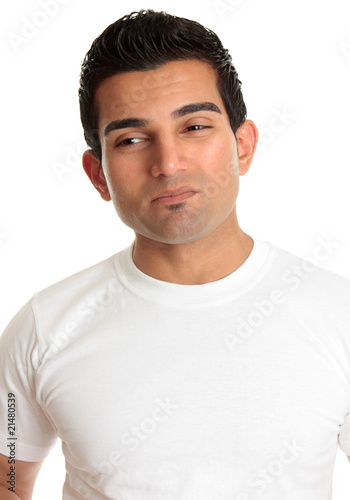 Photo: Apprehensive man wincing dilemma problem Apprehensive man wincing dilemma problem