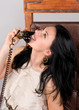 Photo: Beautiful woman speaks by ancient phone Beautiful woman speaks by ancient phone
