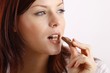 beautiful young woman with a bar of chocolate