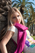 Blonde girl with a palm tree