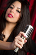 Woman Holding Elvis Microphone