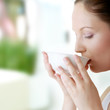 Photo: Woman with clean face drinking grean tea Woman with clean face drinking grean tea