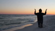 Kneeling In Prayer At Sunset