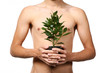 young man with young tree in studio