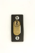 A closeup on a locker in a white door