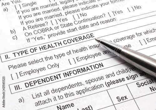 Photo: Health Insurance Application with Pen Health Insurance Application with Pen