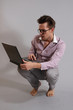 a young man with a laptop