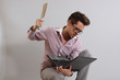a young man with a laptop