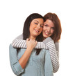 Two girlfriends in a tender embrace