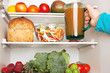 Photo: Taking a jug of fresh carrot and vegetable juice out of the frid Taking a jug of fresh carrot and vegetable juice out of the frid