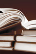stack of books in sepia color