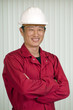 Foto: Engineer in helmet, working in office Engineer in helmet, working in office