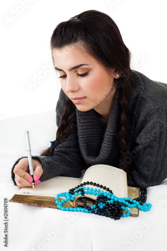 Photo: young woman write memories young woman write memories