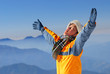asian climber enjoy sunshine with beautiful mountain scenery.