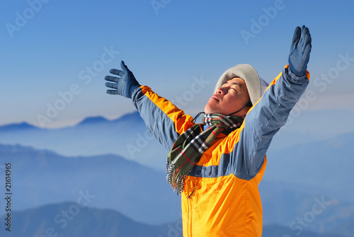 Photo: asian climber enjoy sunshine with beautiful mountain scenery. asian climber enjoy sunshine with beautiful mountain scenery.