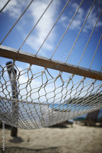 Photo: empty hammock on a sandy beach empty hammock on a sandy beach