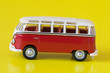 small red bus isolated on yellow background small red bus isolated on yellow background