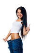 Happy woman demonstrating weight loss Happy woman demonstrating weight loss