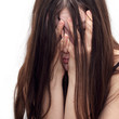 girl in despair shuts the face with the hands