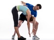 stretching posture by a couple, on studio white background