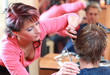 Portrait of professional haidresser cutting young male's hair Portrait of professional haidresser cutting young male's hair