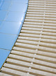 Edge of swimming pool with plastic filter background