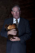 Businessman Clutching a Teddy Bear