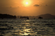 Sun go down between two islands