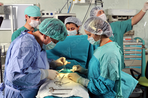Photo: A surgeon team performing an operation A surgeon team performing an operation