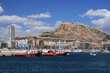 Tug in the port of Alicante and castle