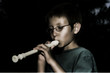 Stylized boy playing Recorder