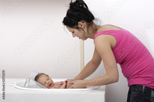 Photo: Mother bathing a baby Mother bathing a baby
