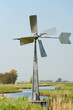 Watermill in vertical Dutch landscape