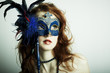 The beautiful young girl in a mysterious mask The beautiful young girl in a mysterious mask