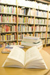 Opened book on desk in library