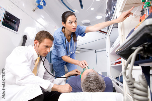 Photo: Nurse putting an oxygen mask Nurse putting an oxygen mask