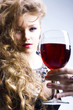 Beautiful woman with glass red wine